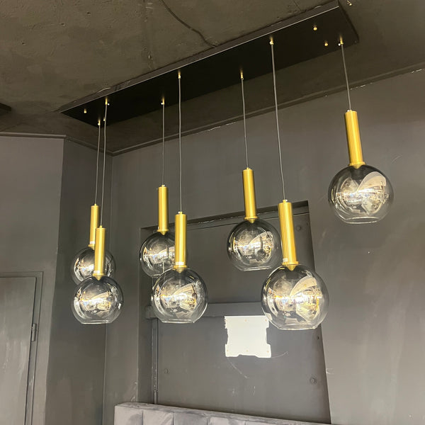 Luxe hanglamp rookglas 7 bollen – voor boven eettafel – staven goud